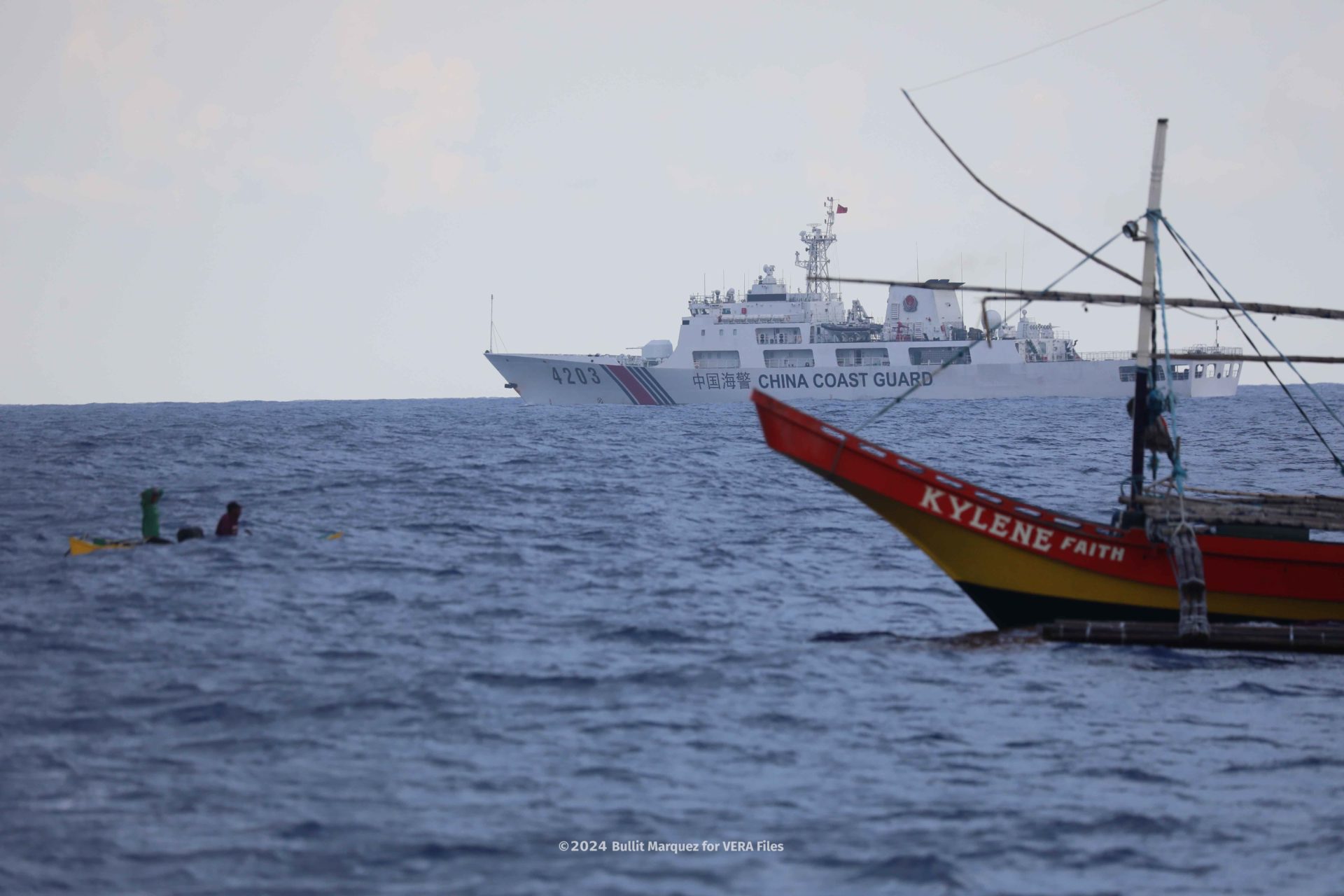 Atin Ito convoy reaches fishermen near Bajo de Masinloc under watchful eye of China’s Coast Guard.3/11 Photo by Bullit Marquez