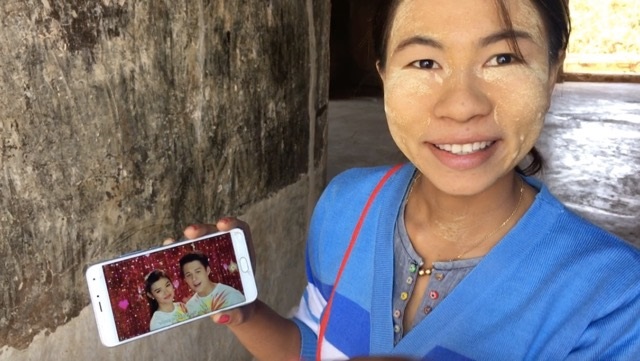 A lady from Myanmar shows two of the reasons why she likes Pinoys.jpg