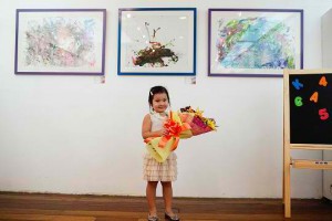 3-year-old girl paints for charity