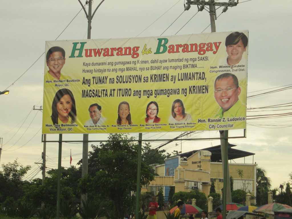 Tarpaulins like this one in front of Congress should be removed before the campaign period, according to Comelec.  Photo by LALA ORDENES.