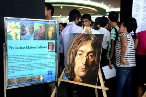 Frederico “Debong” Palines shows his paintings at a job fair in a mall in Baliuag, Bulacan. Photo by EIMOR SANTOS