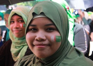 Marguina Dalamban had her face painted with a Bangsamoro emblem as she joins the celebration at the Cotabato City Paza while waiting for the signing of the Comprehensive Agreement on the Bangsamoro between the government and the Moro Islamic Liberation Front. (MindaNews photo by TOTO LOZANO) 