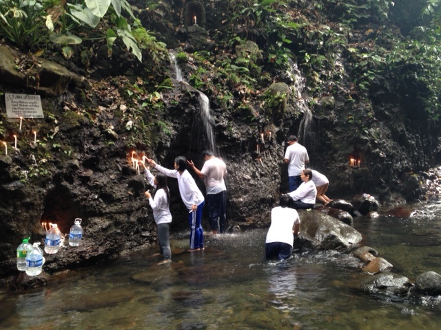Devotees bathe in Sta. Lucia River in Dolores, Quezon.