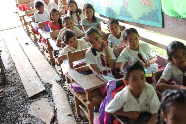 Students from Bancal Elementary School in Carles, Northern Iloilo enjoy a day in school. A new bill proposes to limit the use of schools as evacuation centers after a disaster. (Photo by VJ VILLAFRANCA/SAVE THE CHILDREN)