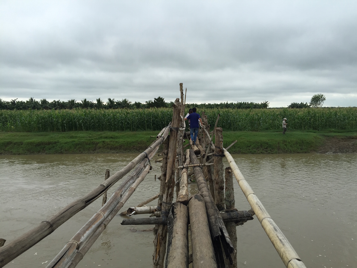 Crossing the wood bridge leads one to the cornfield in Tukanalipao. Photo by JAKE SORIANO