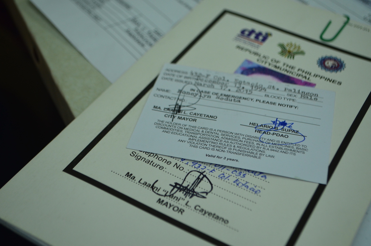 PWD ID and booklet personally signed by Taguig mayor. Photo by VERLIE Q. RETULIN 