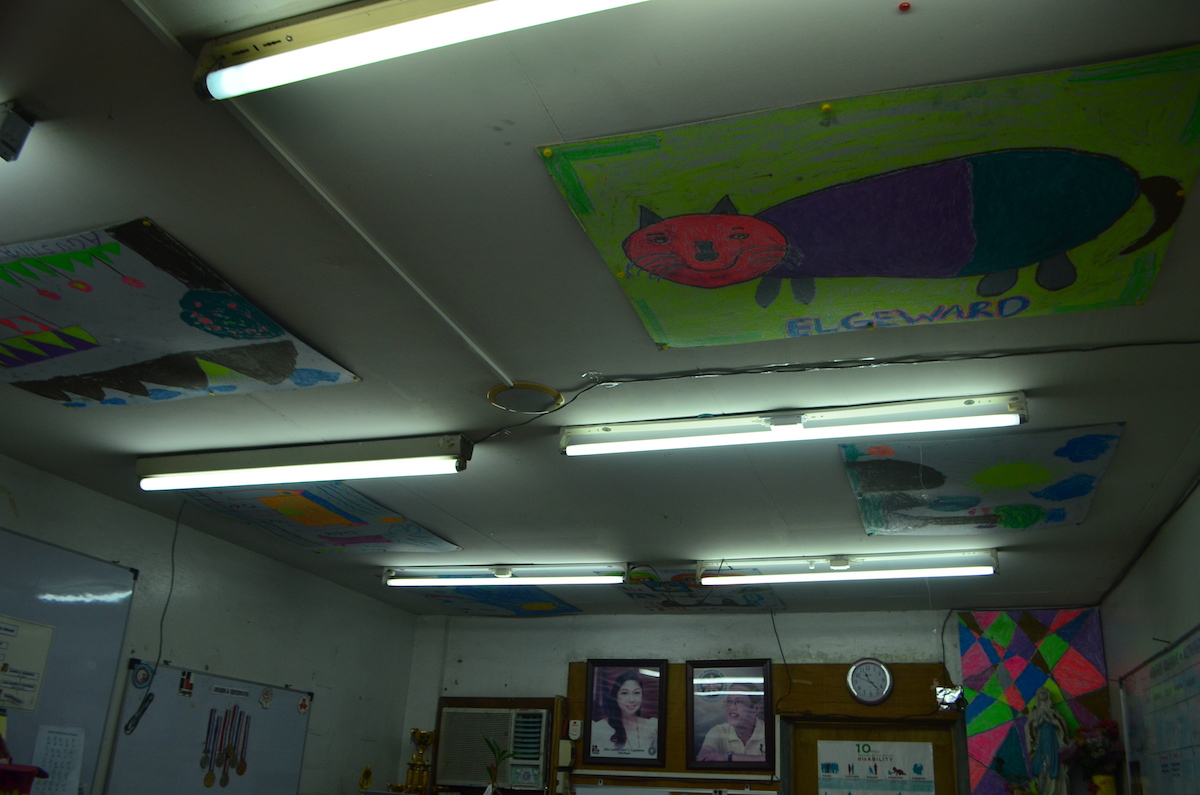 An image of a cat drawn by a child with disability hangs in the ceiling of Taguig City PDAO. Photo by VERLIE Q. RETULIN