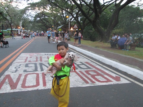 Thomas Manalo, 4, and toy poodle Marimar.