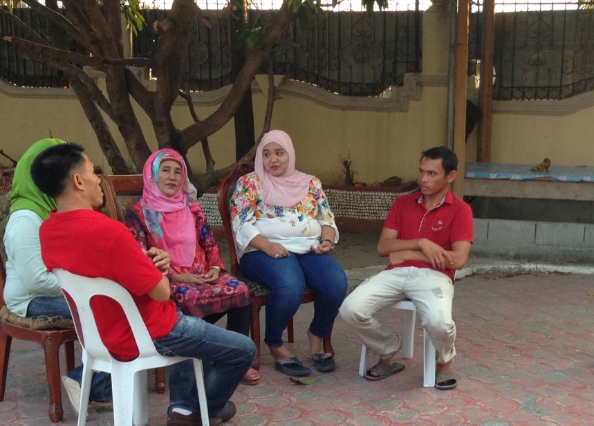 Anhara Ampatuan, vice mayoral candidate of Shariff Aguak and running mate of mayoral candidate Datu Sajid Islam Ampatuan, talks to relatives who are running with her under the banner of the United Nationalist Alliance. 