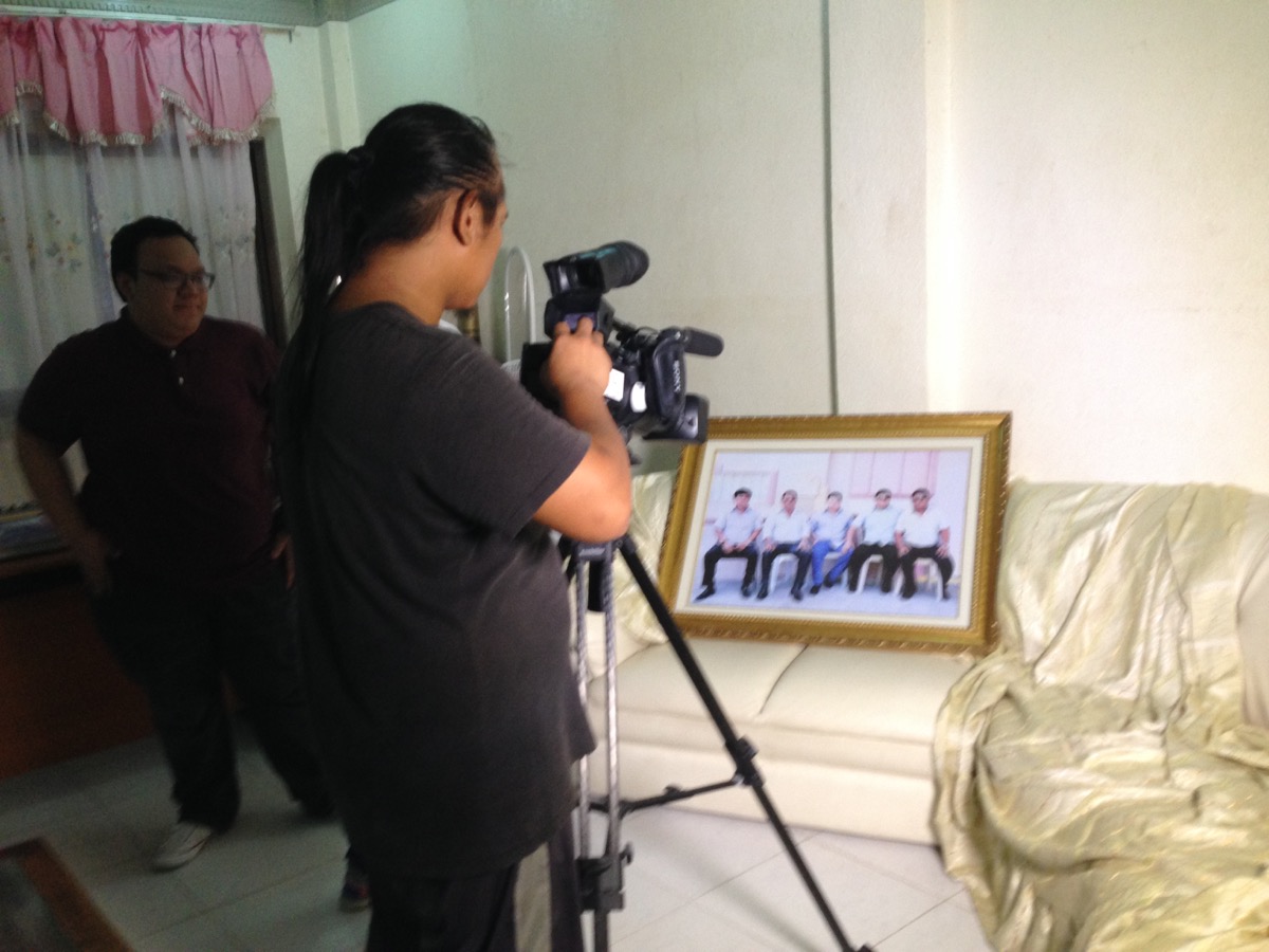 An ABS-CBN cameraman takes a shot of the family photo of Andal Ampatuan Sr and his four sons, all of whom were charged and jailed for the Maguindanao massacre. At the time of the massacre, all of them were government officials--Andal Sr was Maguindanao governor, Sajid Islam was vice governor, Zaldy was ARMM governor, Anwar was mayor of Shariff Aguak and Andal Jr was mayor of Datu Unsay town. 