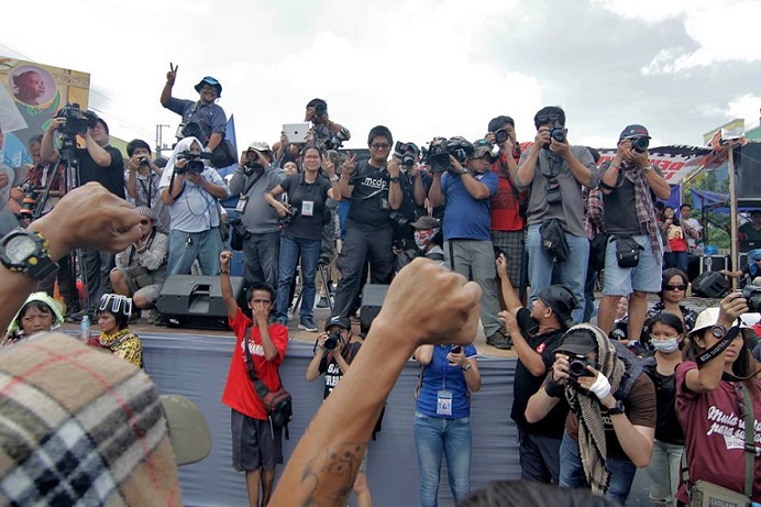 Photo-journalists capture the moment.Photo by Vincent Go