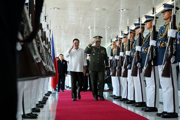 President Rodrigo Duterte, escorted by Armed Forces of the Philippines Chief of Staff Ricardo Visaya, reviews the honor guards before he departed for a a three-day state visit to Japan. Malacañang photo by Richard Madelo.