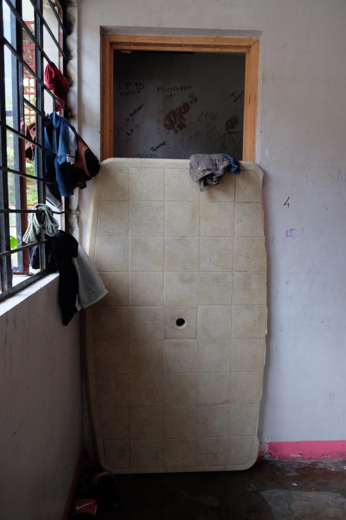 After his ordeal with the police, Jansen was brought to Bahay Sandigan in Malabon. Here, an old monobloc table is used as a makeshift bathroom door in Sandigan's room for CICL. 