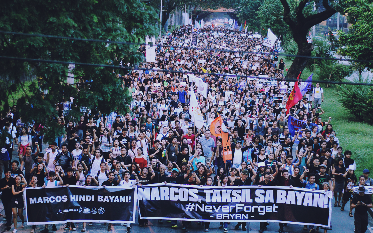 Thousands of students, activists, and martial law victims took to the streets to protest the sudden burial of Marcos. Photo by Paul John Domalaon