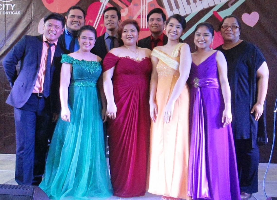 The Viva Voce Singers with their artistic director and founder Camille Lopez Molina, right.jpg