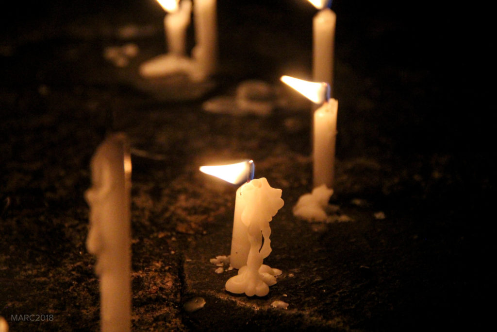The candles are left to burn at the Bantayog ng mga Bayani.