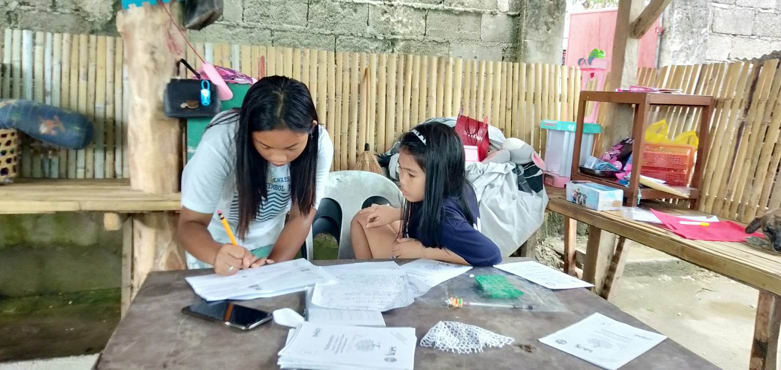 The grandchildren of Pinky de la Paz were trapped with her on the upper floor of the housewhen the typhoon struck last year. (Cooper Resabal)