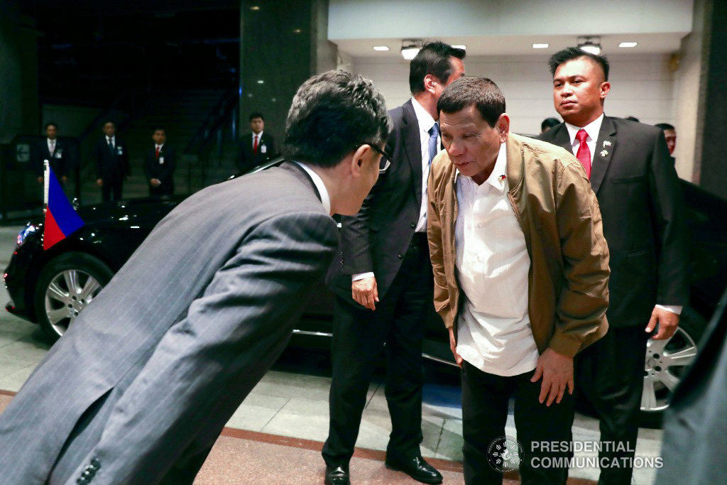 President Rodrigo Roa Duterte shows a gesture of respect to a member of the reception party upon his arrival at a hotel in Tokyo, Japan on May 28, 2019. RICHARD MADELO/PRESIDENTIAL PHOTO