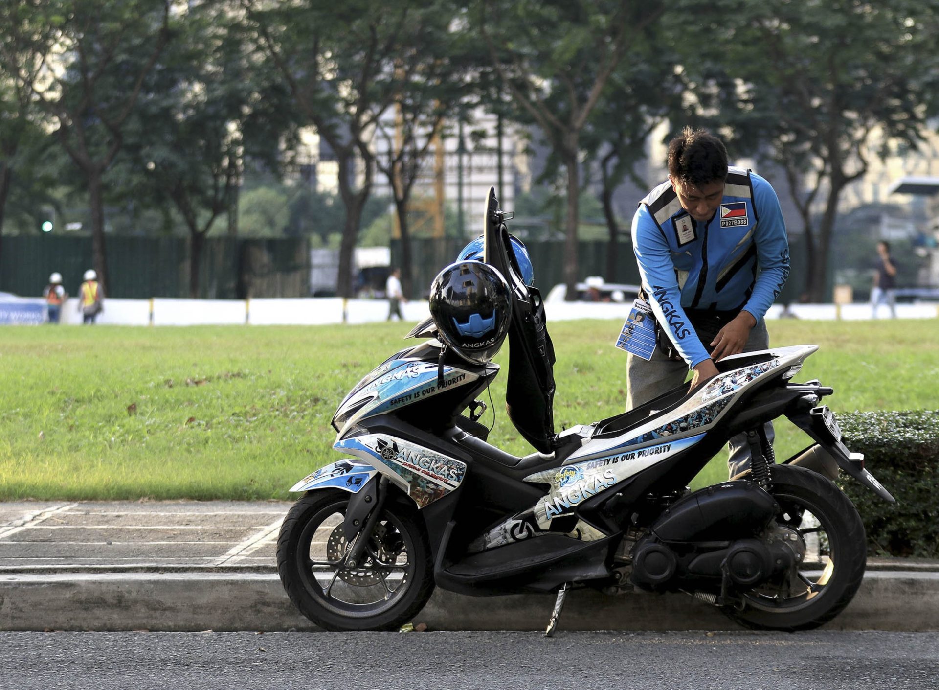 MUST WIN TRUST Switching jobs to have a more flexible schedule and longer family time, Ryan Rillera has joined the ranks of Angkas drivers, who have been given six months to prove government regulators wrong and influence legislation by showing that motorcycles can be safe to operate as public transport. —RICHARD A. REYES