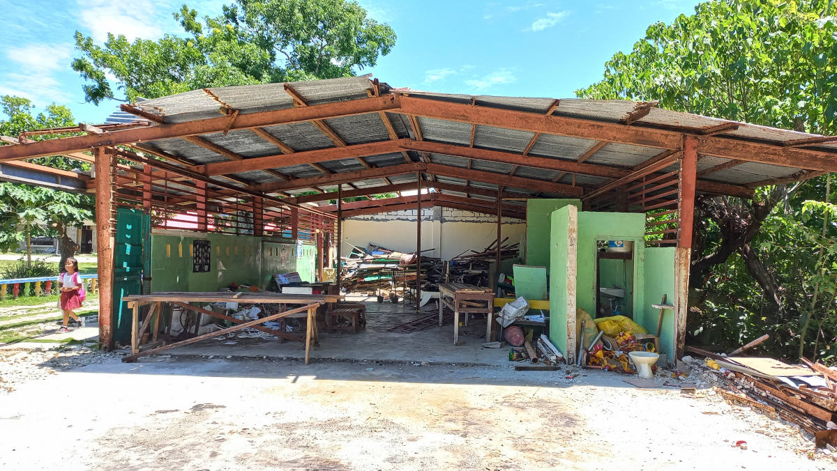 Naked classroom in Talisay Elementary School, Cabilao Island, showing damaged materials and toilet bowl. (Cooper Resabal)