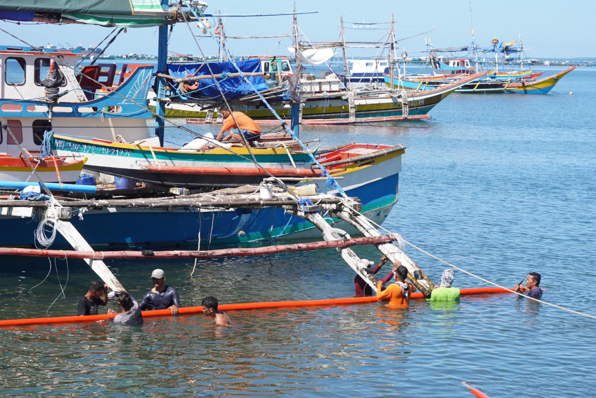 Fishermen in Infanta, Pangasinan prepare their mother boat to try their luck again in the West Philippine Sea. Photo by Ray Zambrano