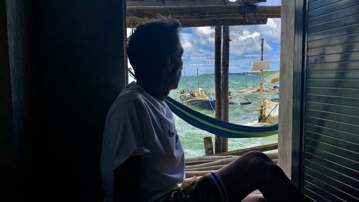 Looking at the vast ocean, a fisherman in Masinloc town, Zambales recalls that life is better before he totally deserted Scarborough Shoal. (Photo by Joanna Rose Aglibot)