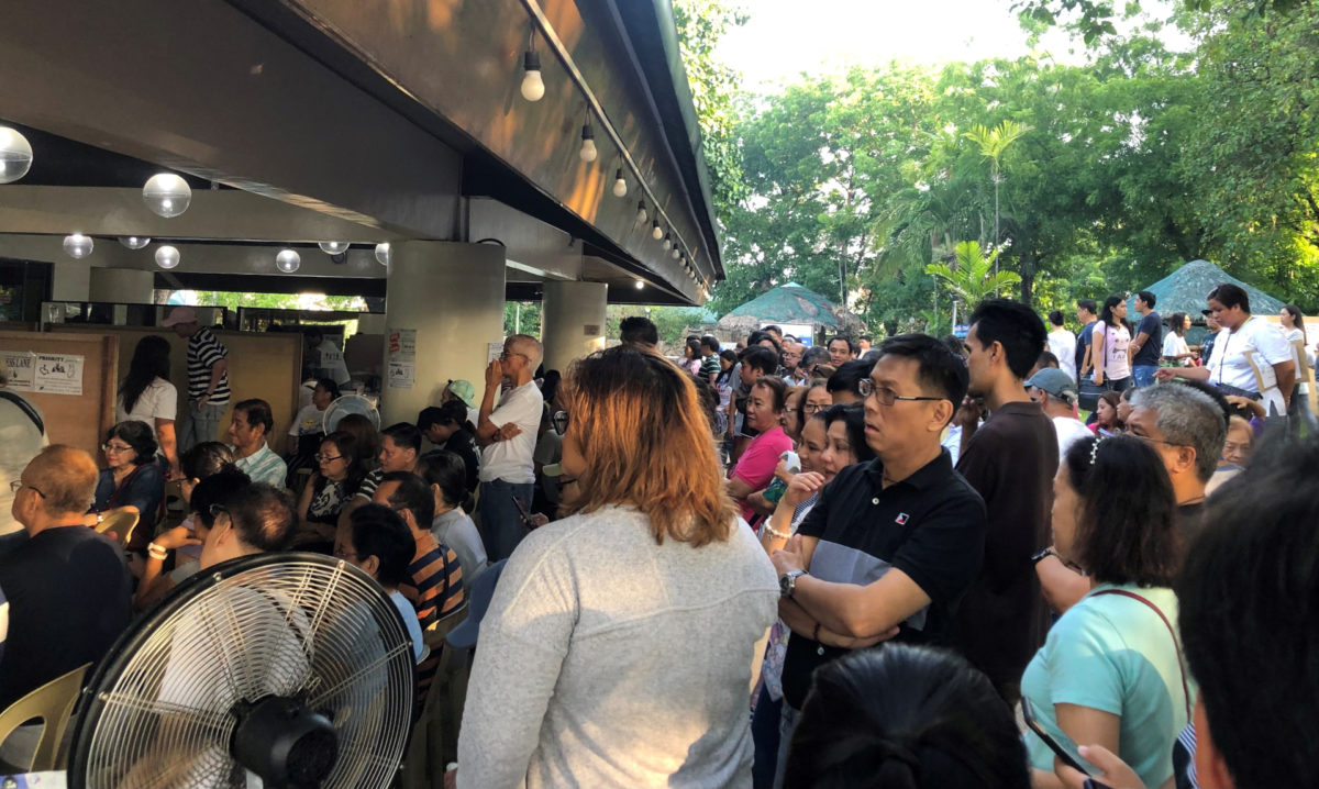 Voters waiting for their turn to vote in a Quezon City village in the 2019 polls. Photo source: Tita Valderama file photo
