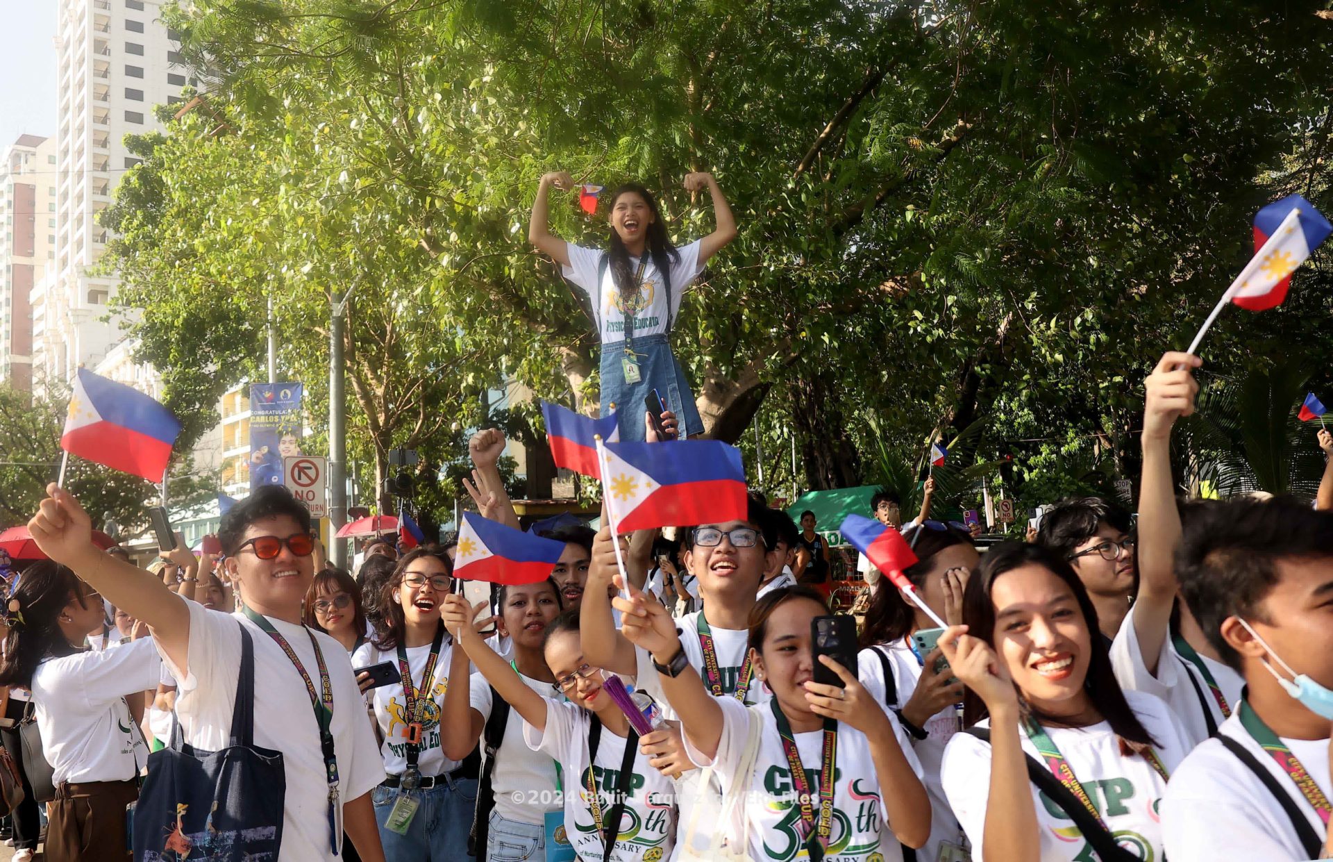 15/18 Heroes’ welcome for Olympians Photo by Bullit Marquez