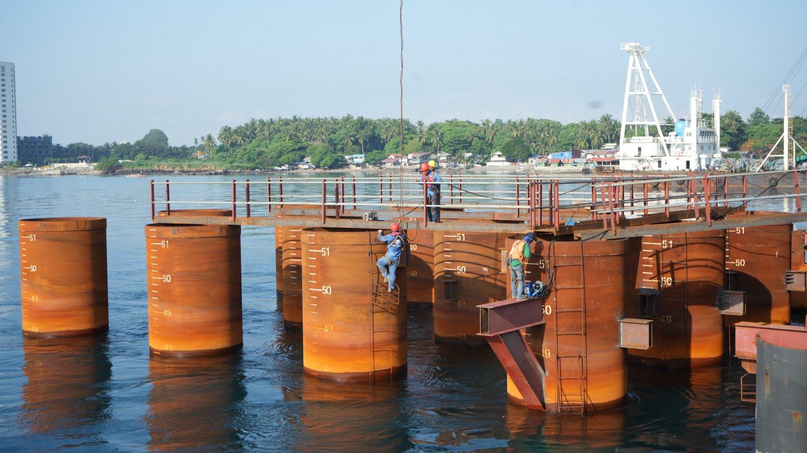 SIDC bored piling works for foundation of the land and marine viaducts. Samal Island - Davao City Interconnector Bridge perspective and preparatory works. Source: DPWH