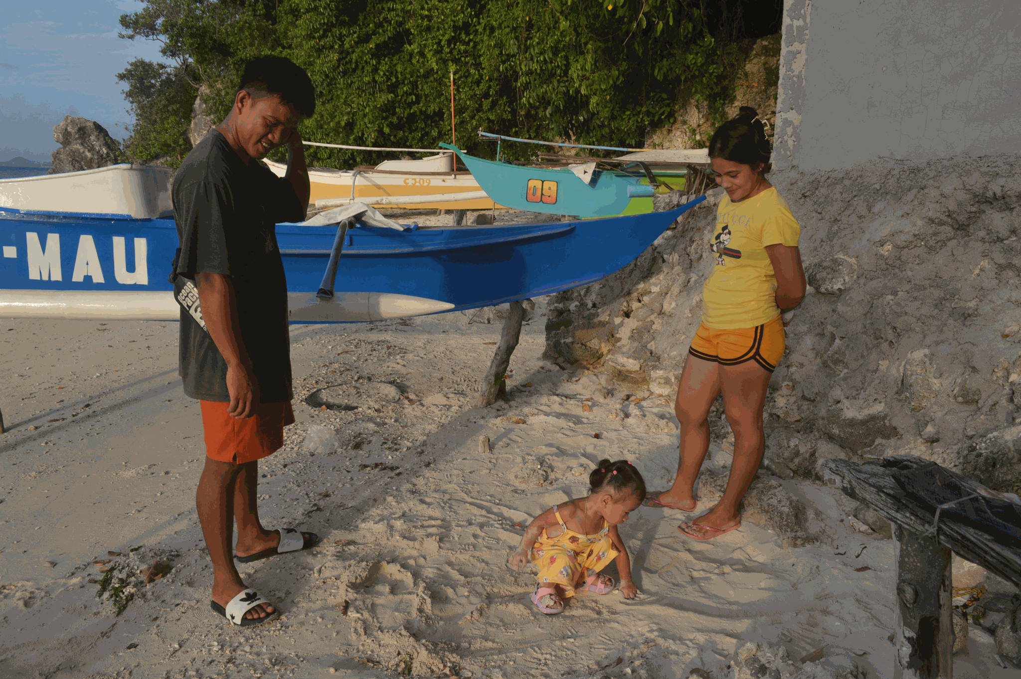 Juanito Guimaras earns income as a boat operator to support his family.