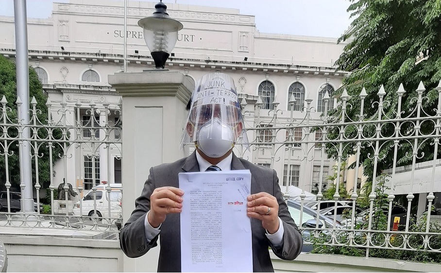 CenterLaw's Gilbert T. Andres holds a copy of the petition vs ATA.jpg