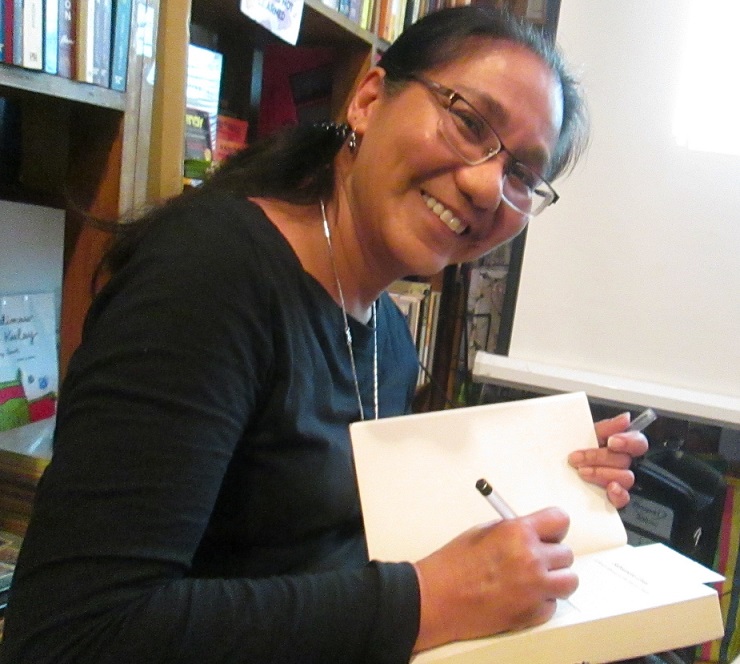 Susan Quimpo signing a copy of her book.jpg