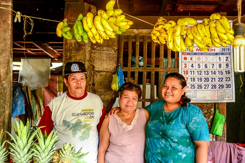 Survivor Nenita Ablen (center) with husband (left) and child (right) who was 2-months old during flood. ((Liza Macalandag).jpg