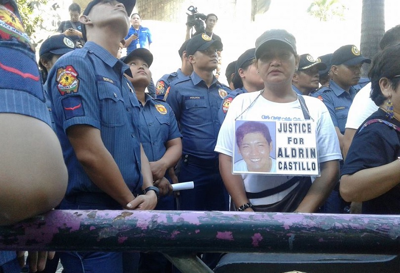 Nanette Castillo surrounded by policemen in one of the rallies against drug war.jpg