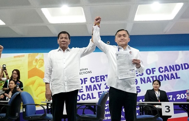 Duterte raised the hand of Bong Go.jpg