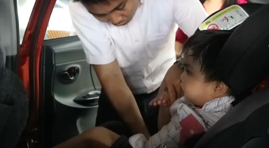 Baby Gelo in a child car seat.JPG