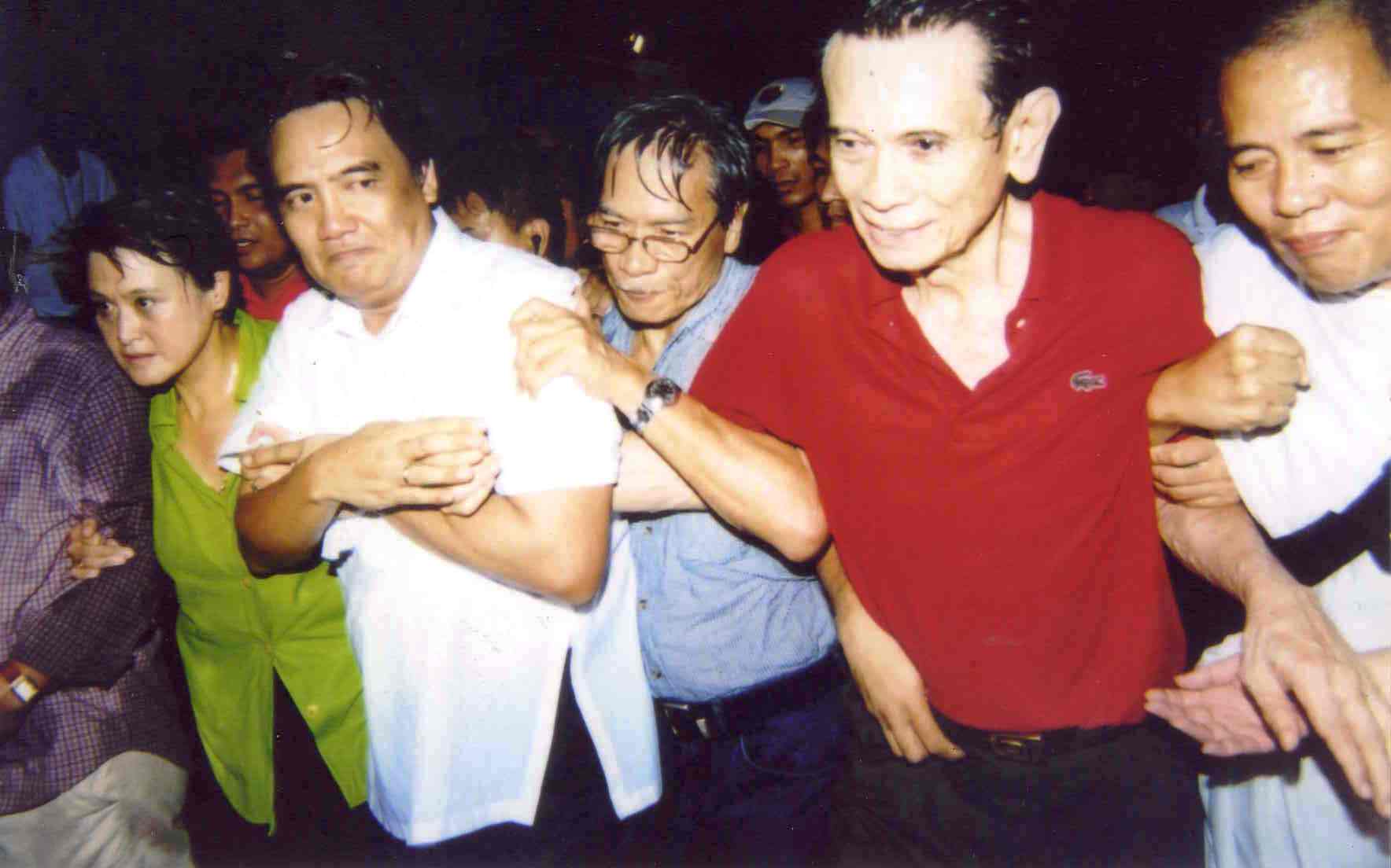 Guingona water-cannoned in an anti-Arroyo rally at Mendiola in 2005